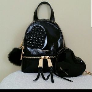 Michael kors leather backpack. Pom pom,coin purse